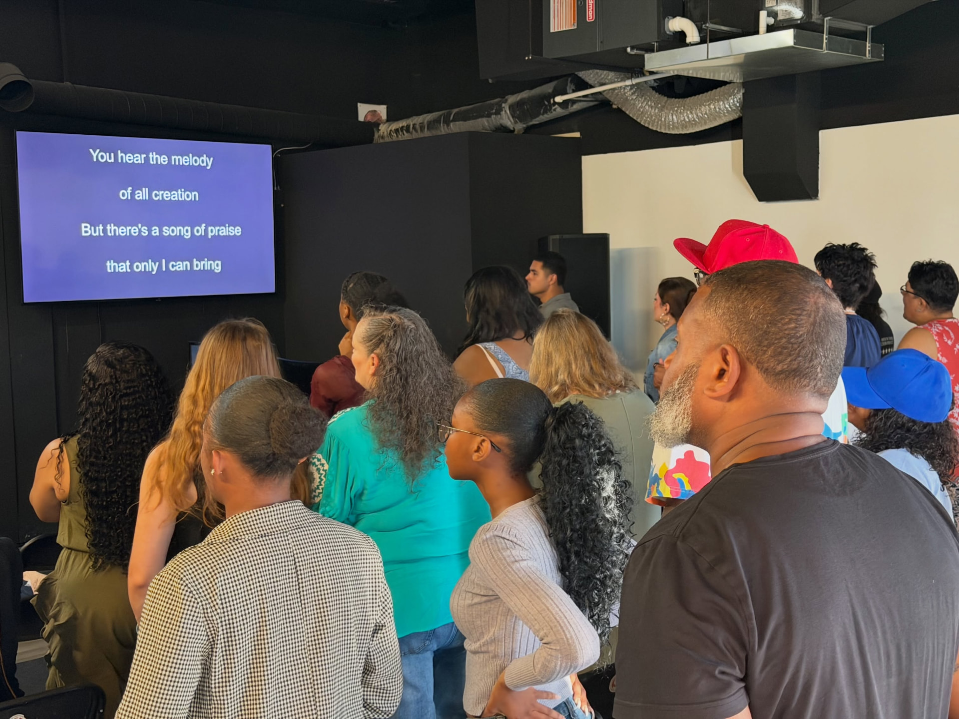 The Cure Church Omaha congregation worshiping together